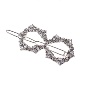 Sparkling silver infinity hair clip with white pearls and rhinestones on white background