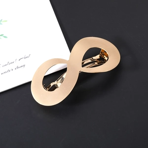 Polished matte gold infinity symbol hair clip with durable spring claw for elegant women