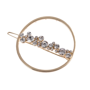 Barrette dorée circulaire évidée avec strass scintillants pour une coiffure élégante