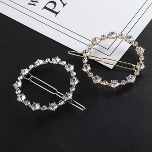Vue détaillée de barrettes rondes en alliage avec strass brillants en or et en argent