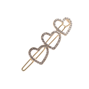 Barrette à cheveux élégante en alliage doré avec trois cœurs creux sertis de strass