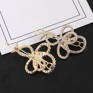 Barrettes papillon dorées élégantes avec strass étincelants et perles blanches