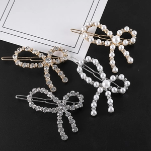 Lot de quatre pinces à cheveux en forme de nœud avec strass et perles élégantes