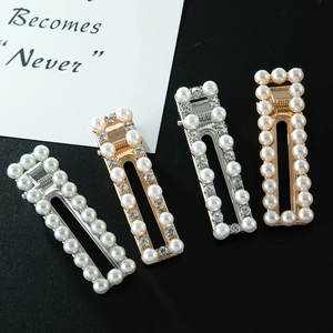 Elegante geometrische haarklemmen met parels en strassteentjes op goud en zilver