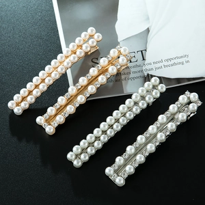 Lot de quatre barrettes à cheveux élégantes en perles et strass dorées et argentées