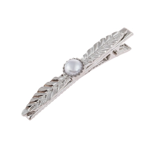 Minimalist silver leaf hair clip with elegant pearl accent on a white background