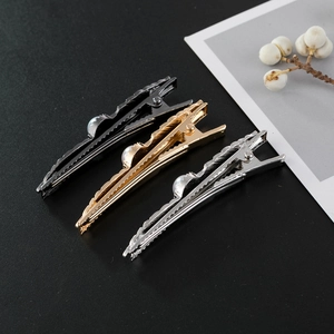 Elegant wavy leaf hair clips in gold silver and black finish with white faux pearls