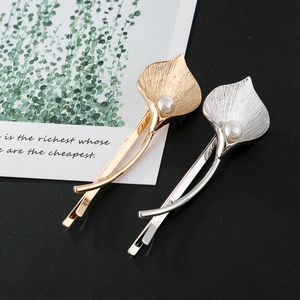 Elegant gold and silver Calla Lily hair clips with pearl detail and brushed metal texture