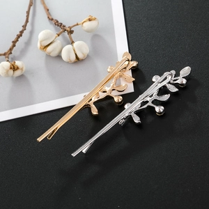 Barrette élégante en forme de branche fleurie avec strass en finitions or et argent