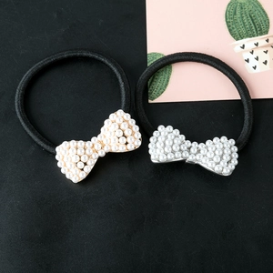 Bow hair ties with sparkling pearls and elastic bands in gold and silver finish