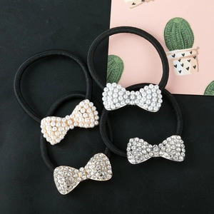 Set of 4 bowknot hair ties with white pearls and sparkling rhinestones for daily wear