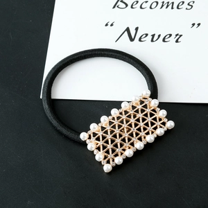 Elegant gold square hair tie with white pearls and small diamonds on black elastic cord