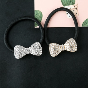 Two-piece sparkling bow hair tie set with rhinestones on black elastic cords