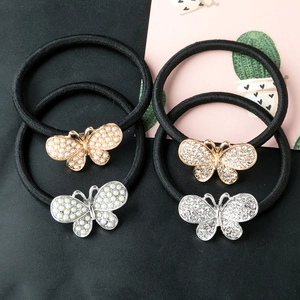 Lot de quatre élastiques à cheveux papillon avec perles et strass sur bandes noires