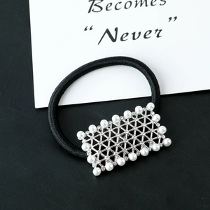 Elegant pearl hair tie with square silver mesh buckle and crystals on a black band
