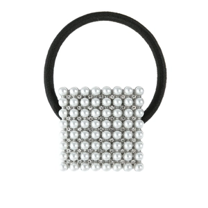 Detail of square hair tie featuring rows of white pearls and sparkling rhinestones