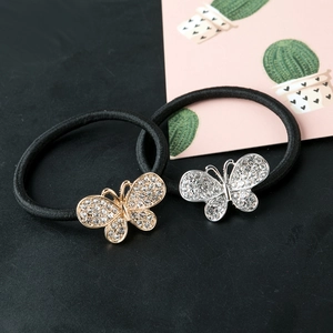 Élastiques à cheveux papillon avec strass et perles, finitions dorée et argentée sur noir