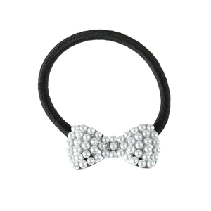Elegant black hair tie with a white pearl bowknot embellishment on a plain background