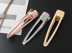 Three-piece set of brushed metal duckbill clips in gold, silver, and rose gold finish