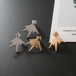 Irregular starburst crown stud earrings in polished gold and silver metal finishes