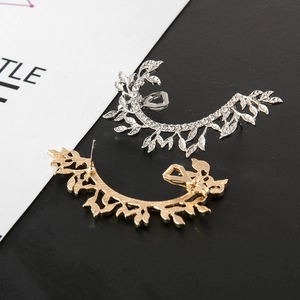 Detailed close-up of leaf-shaped ear cuffs featuring silver rhinestones and gold finish