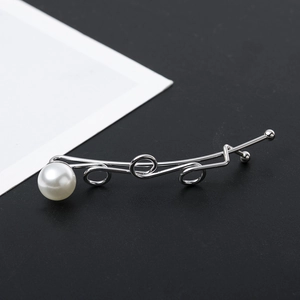 Silver metal twisted loop hair clip with a round white pearl in minimalist style