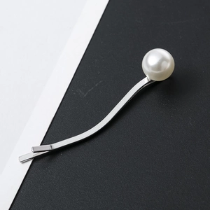 Minimalist silver metal wavy hair clip featuring a smooth white pearl accent for women