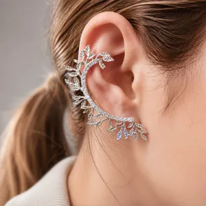 Silver hollow leaf ear cuff with sparkling rhinestones worn on ear model profile