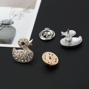 Exquisite duck-shaped alloy brooch featuring shimmering crystals and butterfly clasps
