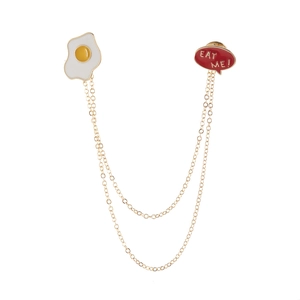 Cute alloy fried egg and red 'EAT ME!' speech bubble lapel pin with double golden chains