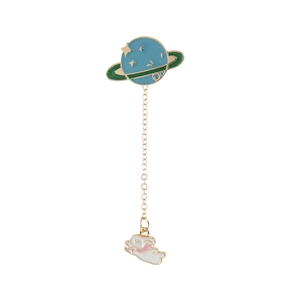 Cute enamel lapel pin with a blue planet and a hanging white rabbit charm on a gold chain