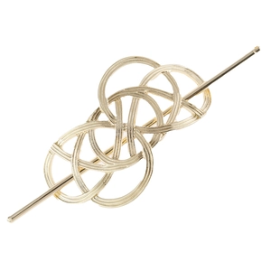 Macro shot of gold metal hair stick with intricate woven knot design and smooth finish