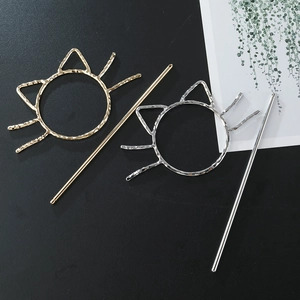 Minimalist cat shaped metal hair sticks in gold and silver with hammered texture
