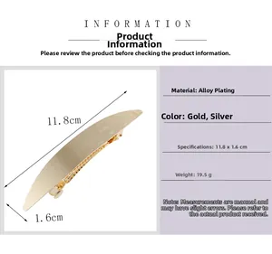 Detail view of large metal hair clip showing 11.8cm dimensions and brushed gold texture