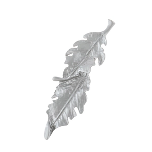Macro shot of silver alloy leaf hair clip with intricate natural vein texture details