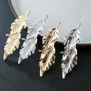 Irregular alloy leaf hair clips in matte gold, silver, and hammered textured finishes