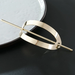Polished gold alloy oval hollow hair slide with pin for modern minimalist styling