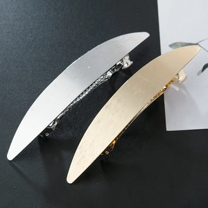 Brushed metal spring hair clips in gold and silver finish for elegant hairstyling