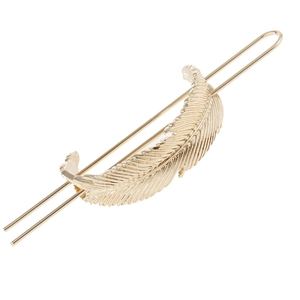 Detail of a hollow gold leaf hair stick with textured matte finish and double prongs