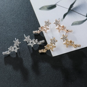 Three pairs of alloy star stud earrings with rhinestones in gold, rose gold and silver
