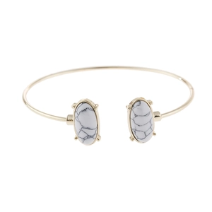 Elegant gold alloy open cuff bracelet with oval white turquoise stones and marble patterns