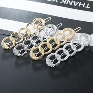Set of four chain-link frog hair clips in polished and matte gold and silver metal finish