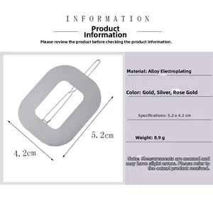 Detail of silver rectangular hollow hair clip with 5.2x4.2cm dimensions and metal texture