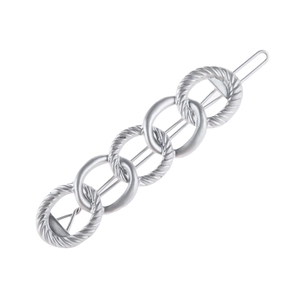 Detailed close-up of a silver alloy chain barrette with textured and polished metal rings