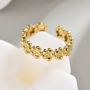 Elegant 14K gold plated open ring featuring a minimalist floral design with small petals