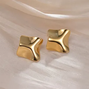 Irregular geometric gold titanium steel earrings with a polished liquid metal finish