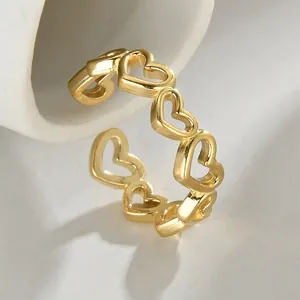 Adjustable golden hollow heart ring in elegant stainless steel with a polished finish