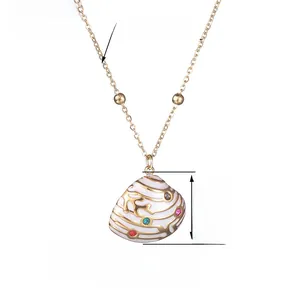 Detail view of shell pendant with gold coral textures and colorful gemstones, 42+5cm chain