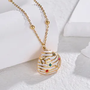 French shell necklace with colorful zircon gemstones and gold coral patterns on white stone