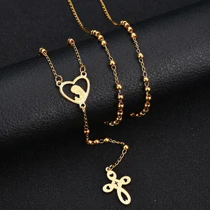 Collana dorata con ciondolo a cuore silhouette e croce su catena a sfere elegante